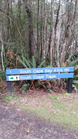 Compass Club South LOCATION Tasmania's South Coast Track will host it's sixth Compass Club event, a 42 and 21 kilometre out and back run to Australia's deepest south. 2022 will also include a 7km Fun Run on the program. Competitors will encounter chilly winds, sprawling plains, rocky cliffs and lengthy boardwalks amongst some of Australia's most stunning landscapes. The event starts with a traditional indigenous Welcome ceremony, in the carpark of the community centre in the serene Cockle Bay. Competitors will make their way down Cockle Creek Road and onto the South Coast Track. The track winds through thick forest, solid boardwalks and a cool, tranquil valley. After a narrow and thick final 500 metres, competitors will meet a burst of sunshine on top of a seaside cliff, marking your arrival at the South East Cape. Your obligatory photograph at Australia's most southern point will be taken, then turn around and head back towards the finish line in Cockle Creek, thus completing your 42.2 kilometre marathon.